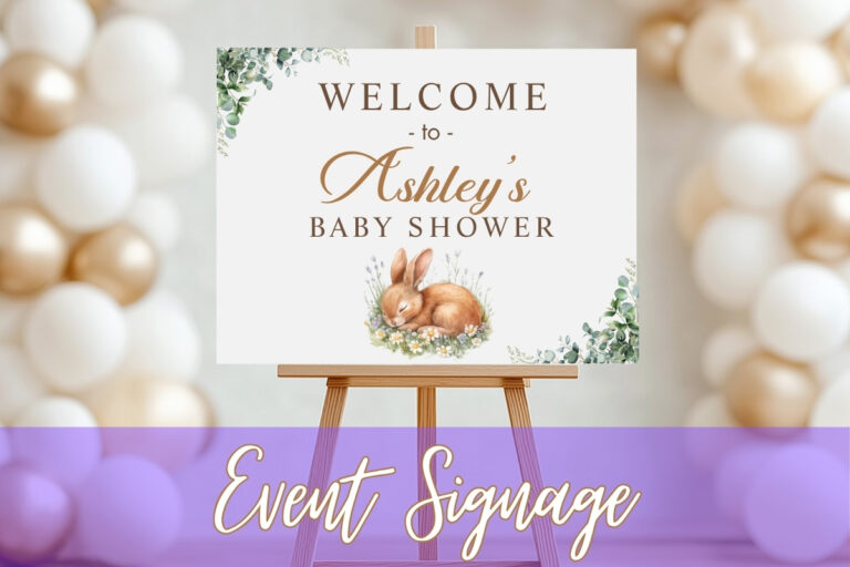 Personalized baby shower welcome sign on easel, featuring floral greenery and bunny illustration with text “Welcome to Ashley’s Baby Shower,” created by Tru Visionz Event Signage.