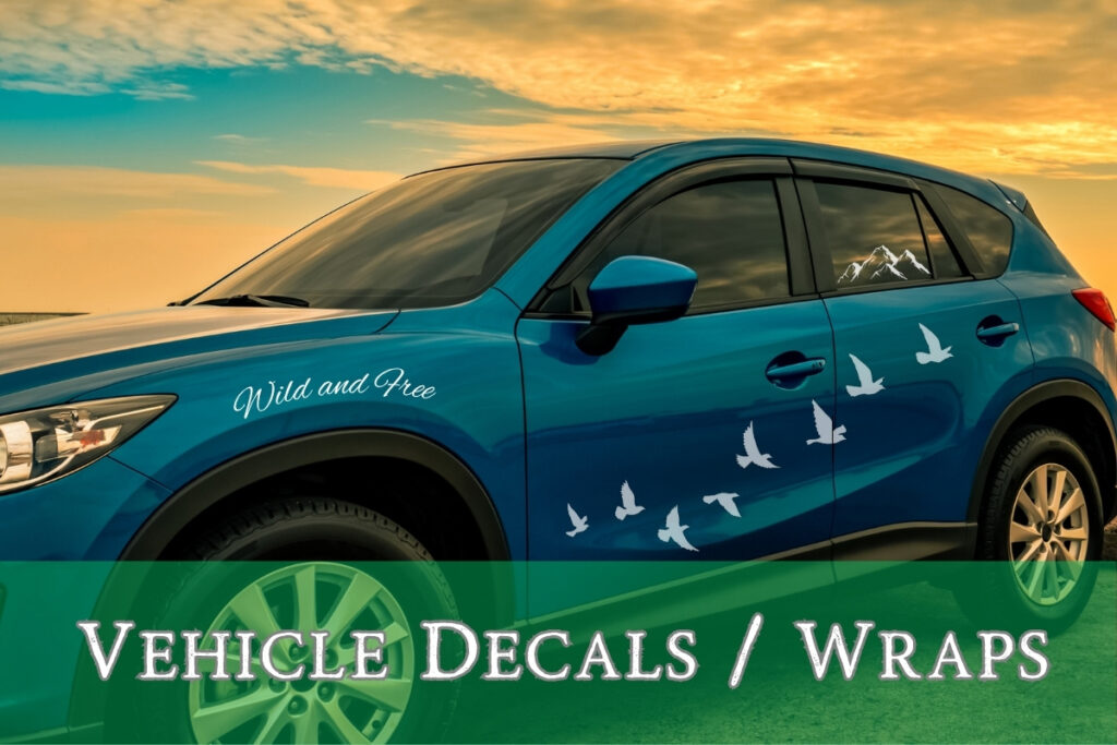 Blue SUV with custom white vinyl decals of flying birds and text “Wild and Free,” designed and installed by Tru Visionz Vehicle Decals and Wraps.